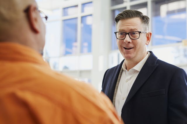Landlord approaching and talking to a tenant