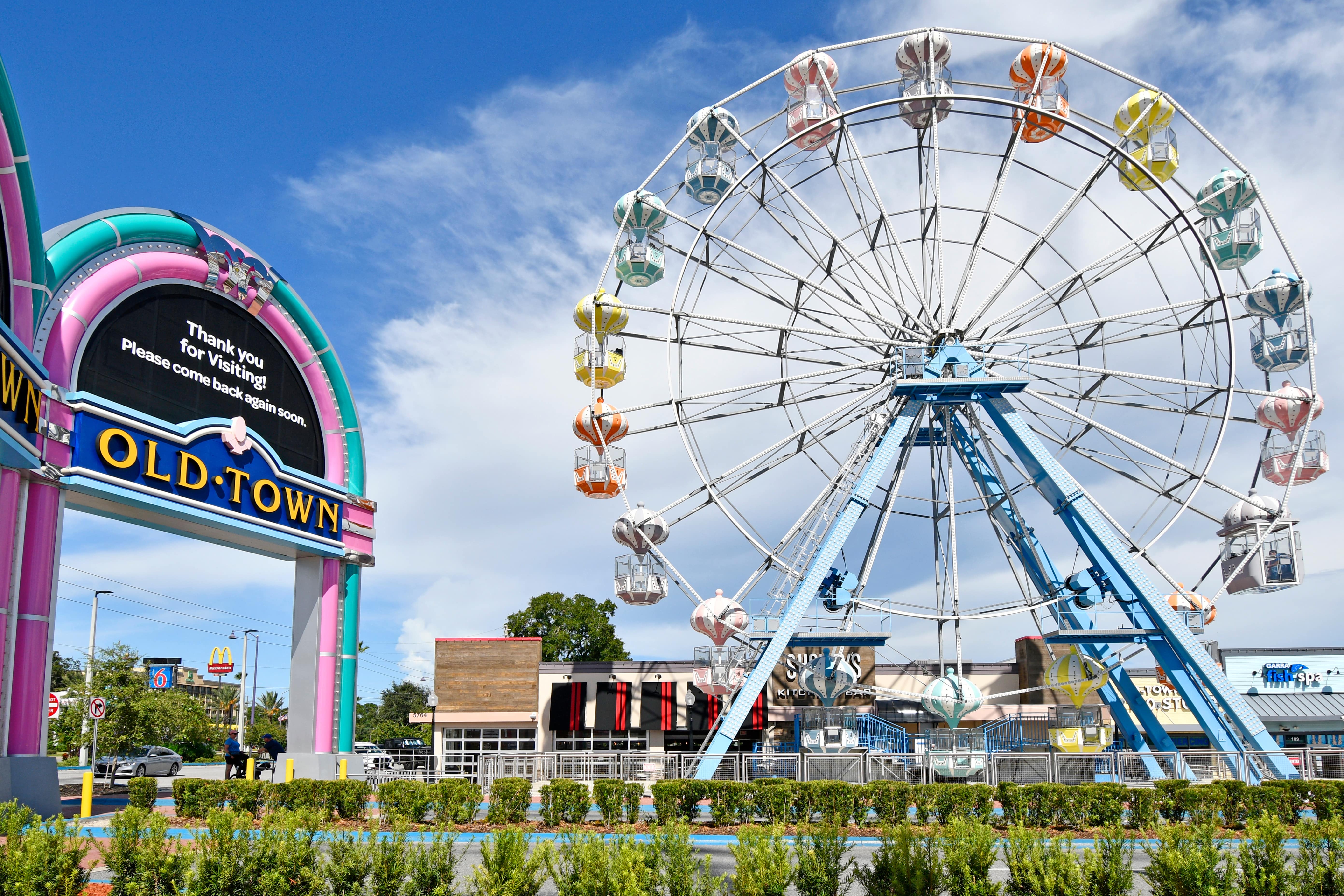 The Ferris wheel and welcome sign at Old Town Kissimmee, representing the city’s entertainment and tourism appeal.