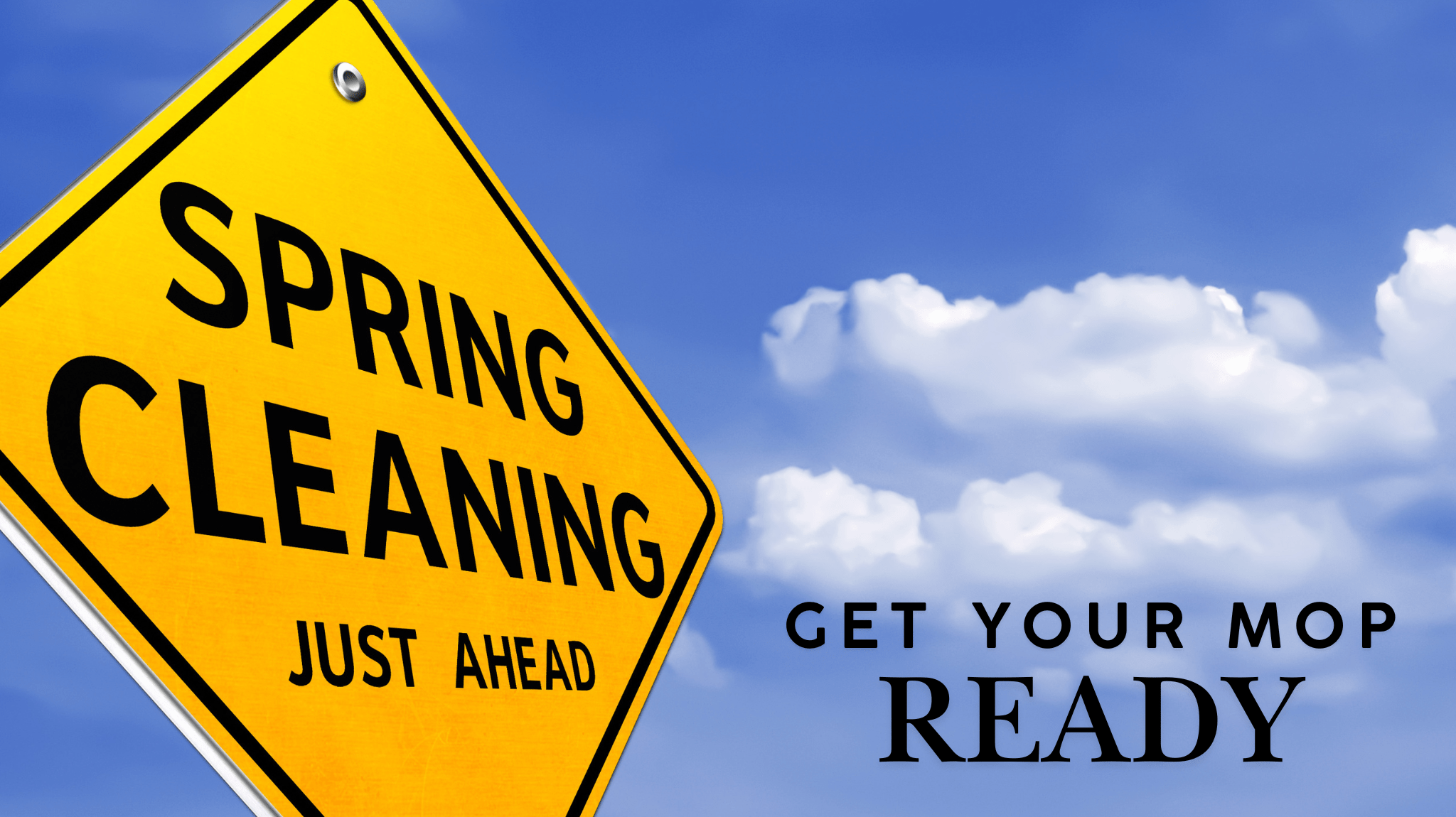 Yellow road sign that says 'Spring Cleaning Just Ahead' with a blue sky background, reminding renters and homeowners to start cleaning.